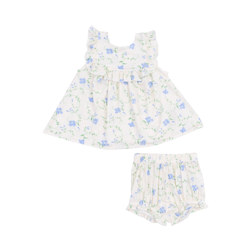 Introducing the Sweet Vines Ruffle Top & Bloomer Set from Angel Dear! Made with our beloved bamboo fabric, this set features a charming floral tunic dress with ruffle accents and matching bloomers adorned with delicate blue flowers. Perfect for infant girls, this set is as comfortable as it is cute.