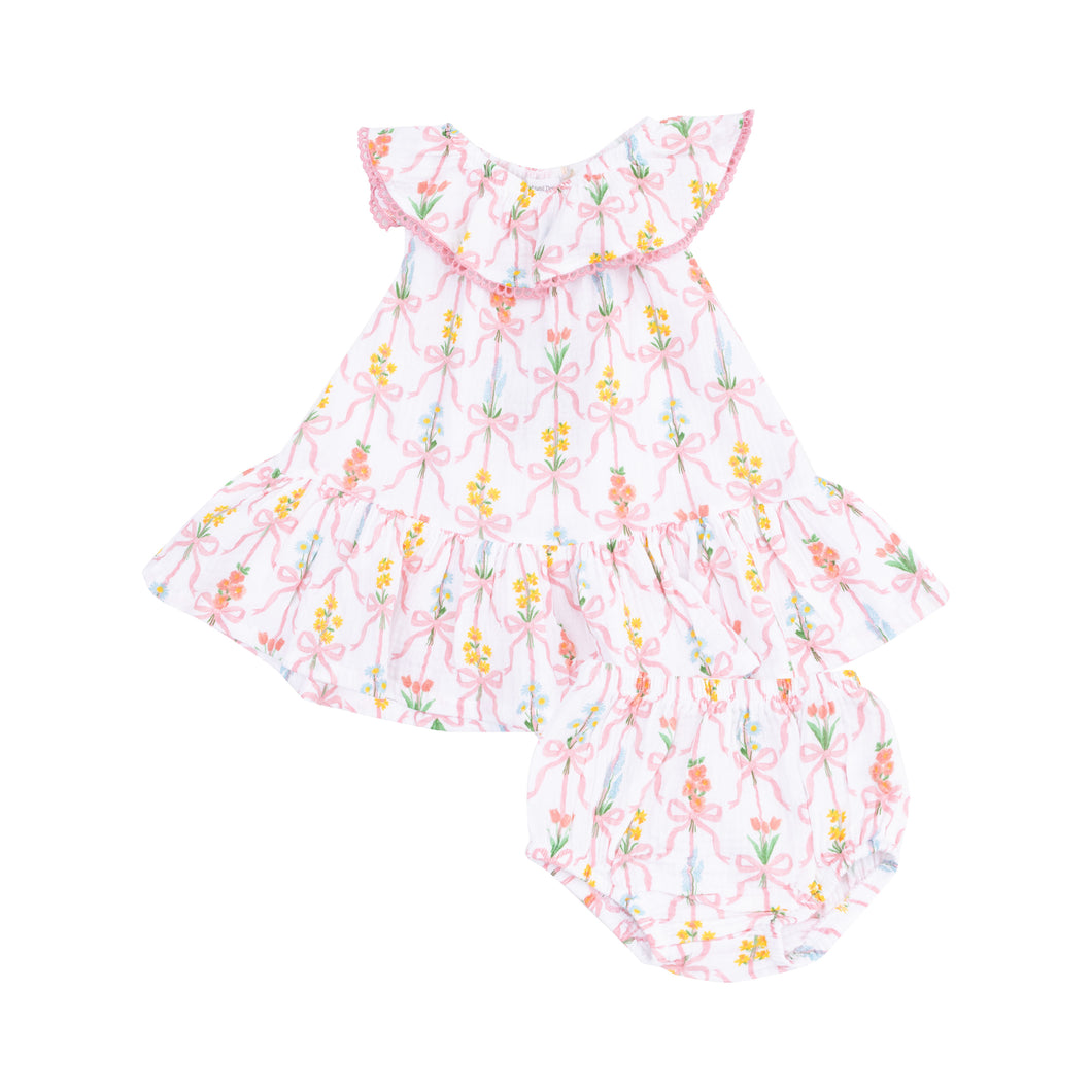 Elevate your toddler's wardrobe with our Girls Ribbon Bouquet Ruffle Neck Dress from Angel Dear! Made with soft muslin fabric and an adorable bouquet flower and ribbon print, this dress features a charming ruffle collar and pom details. Plus, the 18-24m size even includes matching bloomers for a complete look. Perfect for any occasion!