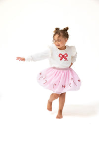 Add a touch of festive fun to your little one’s wardrobe with the Candy Canes Tutu Skirt from Angel Dear. This playful pink tutu is accented with sparkling sequined candy canes, making it perfect for holiday celebrations. Pair it with the matching Candy Canes Ruffle Shoulder French Terry Sweatshirt for an adorable, coordinated look that’s both stylish and comfortable.&nbsp;