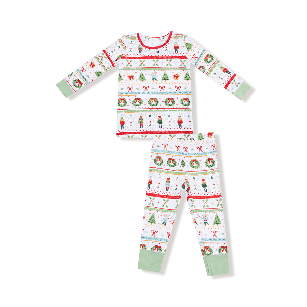 Keep your little one cozy this holiday season with the Boy's Nutcracker Fair Isle Long Sleeve Pajama Set. Crafted from soft, breathable bamboo fabric, this set features a charming Nutcracker and classic Fair Isle print that captures festive spirit beautifully. Perfect for toddler boys, it ensures comfort throughout the night while adding a delightful seasonal touch. Coordinate with matching footie and romper options for adorable sibling holiday photos and celebrations.