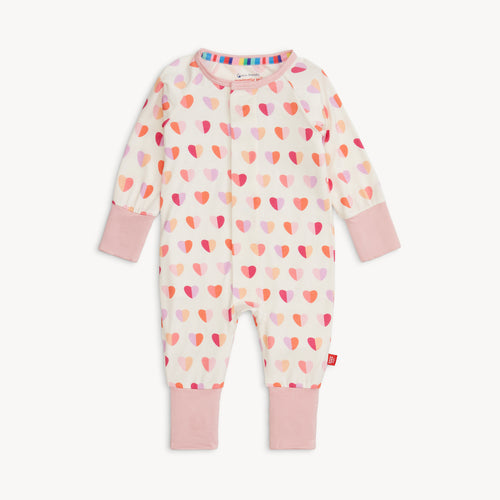 Pink XOXO Hearts Modal Convertible Coverall from Magnetic Me. Features bright blue hearts and the Magnetic Me's convenient magnet closures. A versatile footie that converts into a coverall, with features to extend the outfit's life.