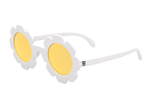 Load image into Gallery viewer, Say hello to the sweetest shades of the season! Featuring crisp white frames and warm yellow mirrored lenses, these standout sunnies are turn every sunny day into a blooming adventure and are perfect for little trendsetters who love to shine. From playground playdates to family vacations, they add a touch of fun and a little extra magic to every sunny moment. Each pair of sunglasses comes with a microfiber storage bag that doubles as a cleaning cloth to keep your little one’s shades safe and clean.
