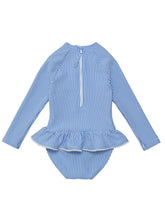 Load image into Gallery viewer, Experience elegance and sun safety with our Parisian Long Sleeve Skirted Swimsuit! Embrace classic blue and white seersucker stripes, charming white pompom trim, and a functional white back zip. This SnapperRock one-piece is perfect for infants who love to make a stylish splash.
