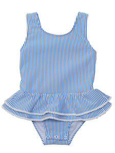 Bring the charm of Paris to the beach with this adorable skirted swimsuit. The blue and white seersucker stripes and white mini pompom accents give it a stylish and playful look. The airy open back with a bow detail adds a cute flair. Perfect for any fashionable toddler girl! From SnapperRock.
