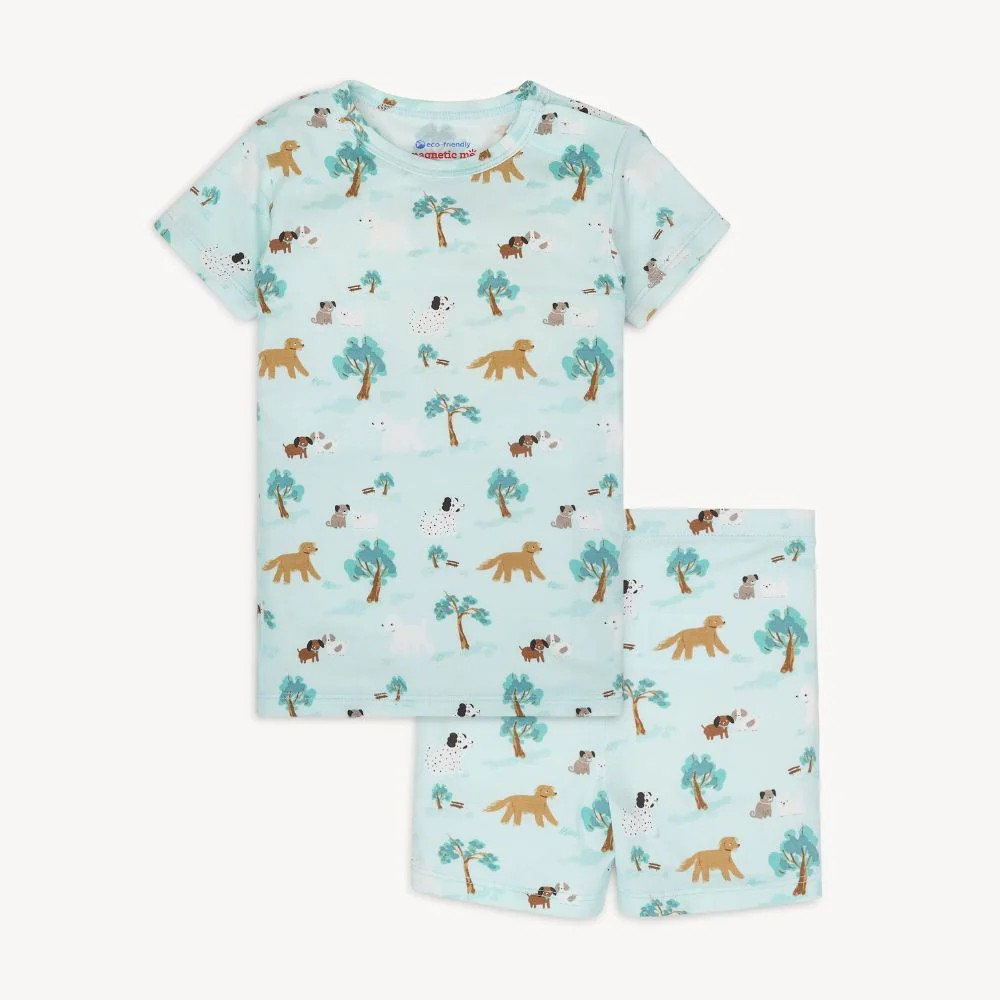 The Central Bark Pajama Short Set by Magnetic Me makes bedtime easy and fun with its playful puppy park design. Crafted from eco-friendly TENCEL™ modal fabric, these pajamas are soft, breathable, and gentle on your child’s skin. The innovative magnetic closure at the neck lets kids dress themselves effortlessly, eliminating the usual over-the-head struggles. Designed for a snug, comfortable fit, this set ensures a cozy night’s sleep while encouraging independence.