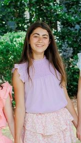 The Annie Top in Lilac from Pleat is the perfect addition to any tween girl's wardrobe. Made with lightweight chiffon material, it features a smocked top and ruffle sleeves for a touch of feminine charm. Versatile enough to be paired with shorts or jeans for a casual look, or with one of our tiered skirts for a dressier ensemble. Elevate your style with Pleat!