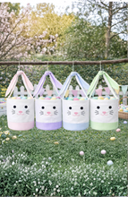 Load image into Gallery viewer, Celebrate the magic of springtime with a seersucker-trimmed Bunny Basket made for egg-hunting, Sunday morning surprises, and all of the excitement that the holiday has in store. With bunny ear straps and sweet bunny face embroidery, these large cotton totes are constructed of soft stone canvas and pastel seersucker and can be customized with a name for that extra special added detail.

Easter Bunny-approved bunny face embroidery ready for springtime celebrations
Perfect for kids of all ages
Great for holida
