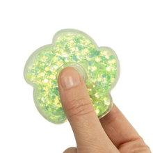 Load image into Gallery viewer, Mesmerizing Glitter spinner features a modern flower design with a safely concealed, colorful glitter liquid. Available in a variety of colors, including pink, yellow and green. Flick the spinner and watch as the mesmerizing glitter moves and floats to create an enchanting effect.
