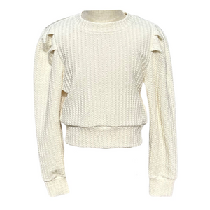 The Jane Sweatshirt Textured Cream from Pleat combines cozy comfort with stylish design, perfect for tween girls. Its soft, textured fabric and charming puff sleeves add a fashionable touch to everyday wear, making it an ideal choice for both casual outings and special occasions. Elevate her wardrobe with this versatile and trendy sweatshirt.