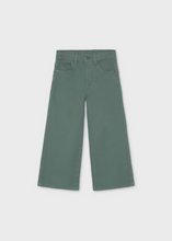 Load image into Gallery viewer, Effortless style meets playful design with these Girls Wide Leg Twill Pants in soft sage green. Crafted from quality twill, the relaxed wide-leg silhouette offers comfortable everyday wear, while charming pocket details add a whimsical touch that sets them apart. Layer with any sweater or blouse from the Mayoral or Pleat collections for a polished, coordinated look.
