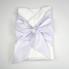 Load image into Gallery viewer, You’ll never want to wrap your bundle of joy in anything else after you see how comfortable they are in this Pima cotton Swaddle Wrap from Marcela Gifts. It’s made of 100% Peruvian Pima cotton, for the softest touch possible. Add a monogram to the sash to add a sweet personalized touch.&nbsp;
