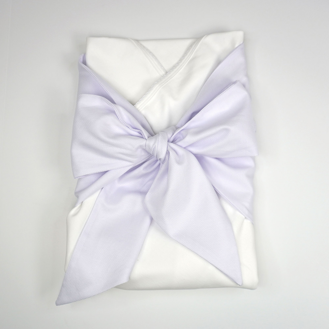 You’ll never want to wrap your bundle of joy in anything else after you see how comfortable they are in this Pima cotton Swaddle Wrap from Marcela Gifts. It’s made of 100% Peruvian Pima cotton, for the softest touch possible. Add a monogram to the sash to add a sweet personalized touch. 