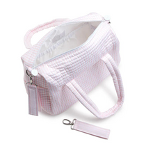Load image into Gallery viewer, Fit all of your essentials with ease when you carry this perfectly designed&nbsp;Stroller&nbsp;Bag that can be worn as a tote, crossbody, or it can be Velcro onto your stroller.&nbsp; Crafted in a water repellant material, this versatile bag features enough space to hold bottles, blankets, and toys for you and your baby. Built with interior pockets to hold essentials, 2 exterior side slip pockets for bottles, removable straps and is machine washable.
