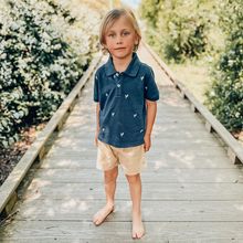 Load image into Gallery viewer, New for Boys! A fresh, more tailored look takes shape on our new to the collection Boys Jackson Short. Available in Navy or Khaki, this pull-on elastic waist short features belt loops at the waist, roomy side pockets sized perfectly for found treasures, and our signature bright blue thread detail on the fixed button at waist. Pair with our Boys Jack Shirt for a perfectly pulled-together look.
