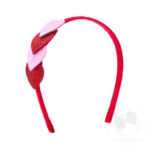 More sparkles, more fun! This Valentine's headband features hearts-galore and our classic grosgrain ribbon wrapped headband for a comfortable fit.